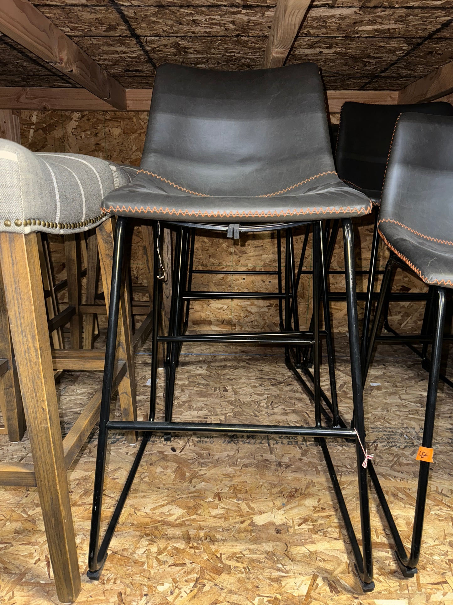 Black Counter Stool with Orange Stitch