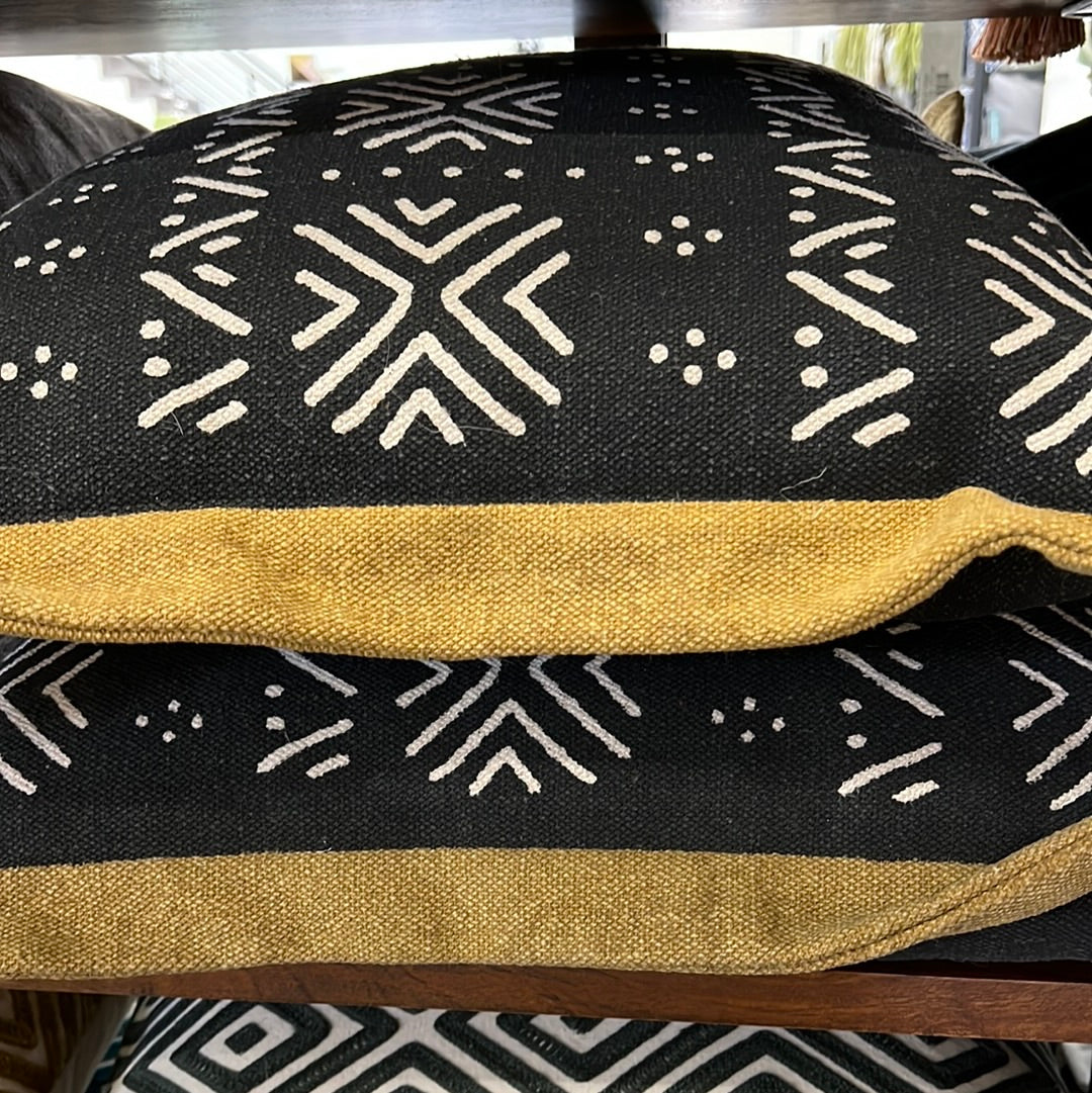 Black and mustard pillow