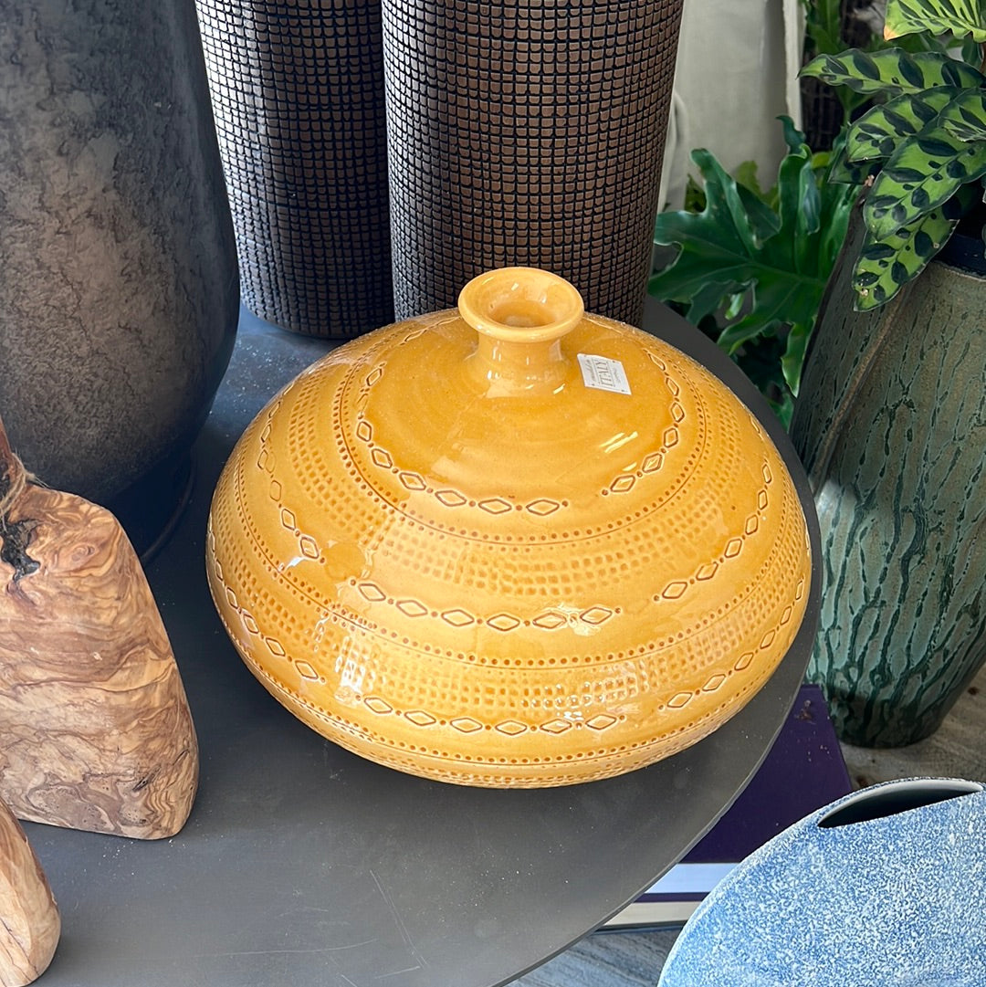 Yellow pot with engraving