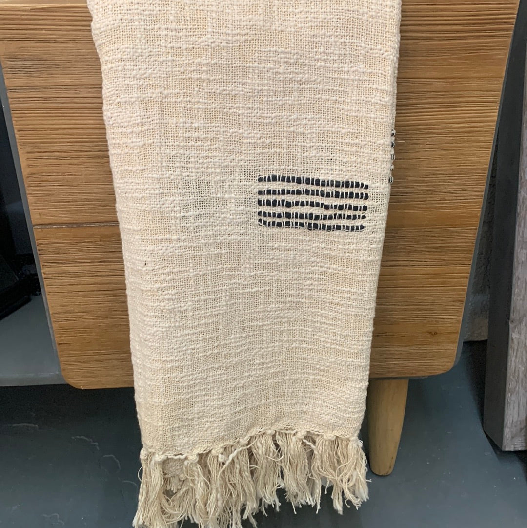 Off white throw blanket with black accents