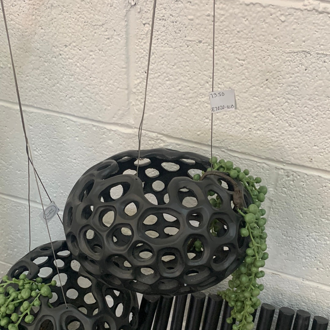 Black hanging planter with holes