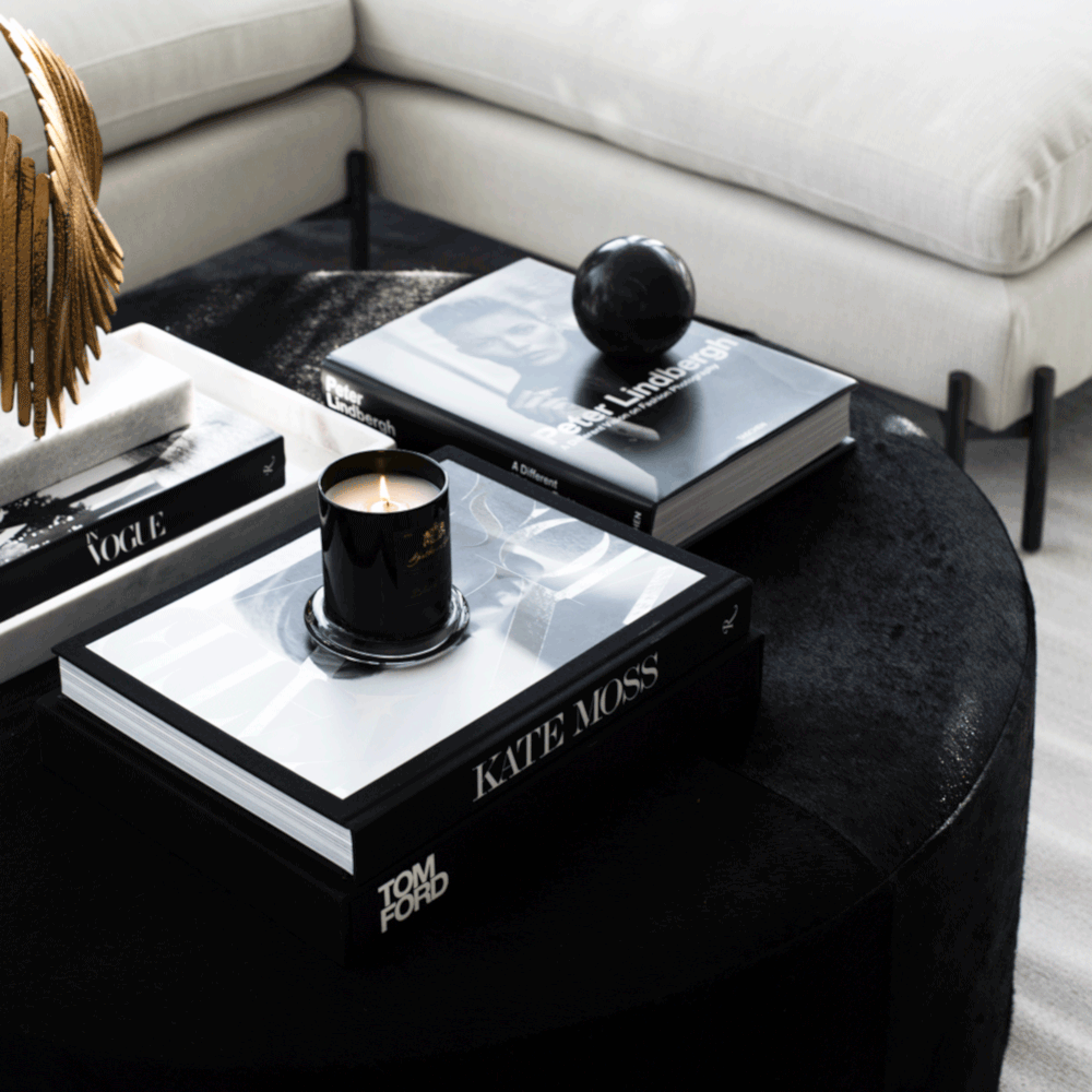 Ottoman Black Cowhide St. Francis