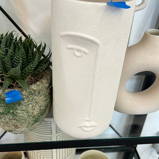 Half face vase