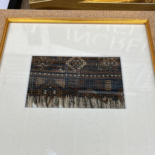 Woven fabric in antique frame