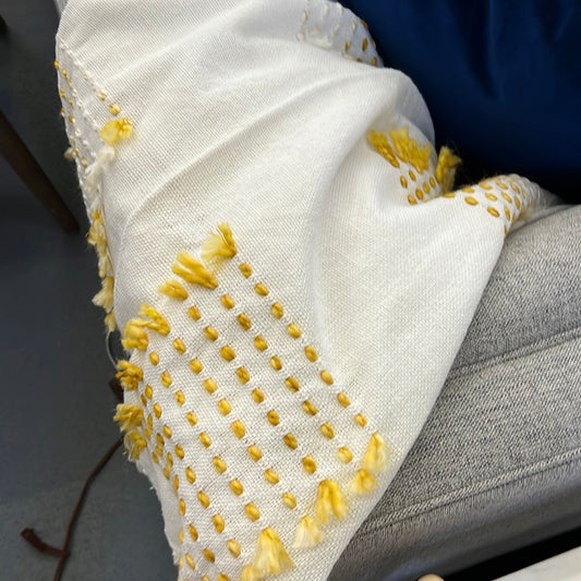 White and yellow throw