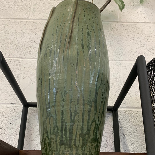 Folded green floor vase