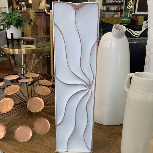 Triangular white vase with bronze