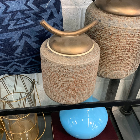 Ceramic jar with gold arch handle lif