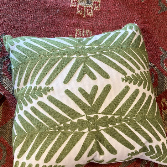 Green and white throw pillow